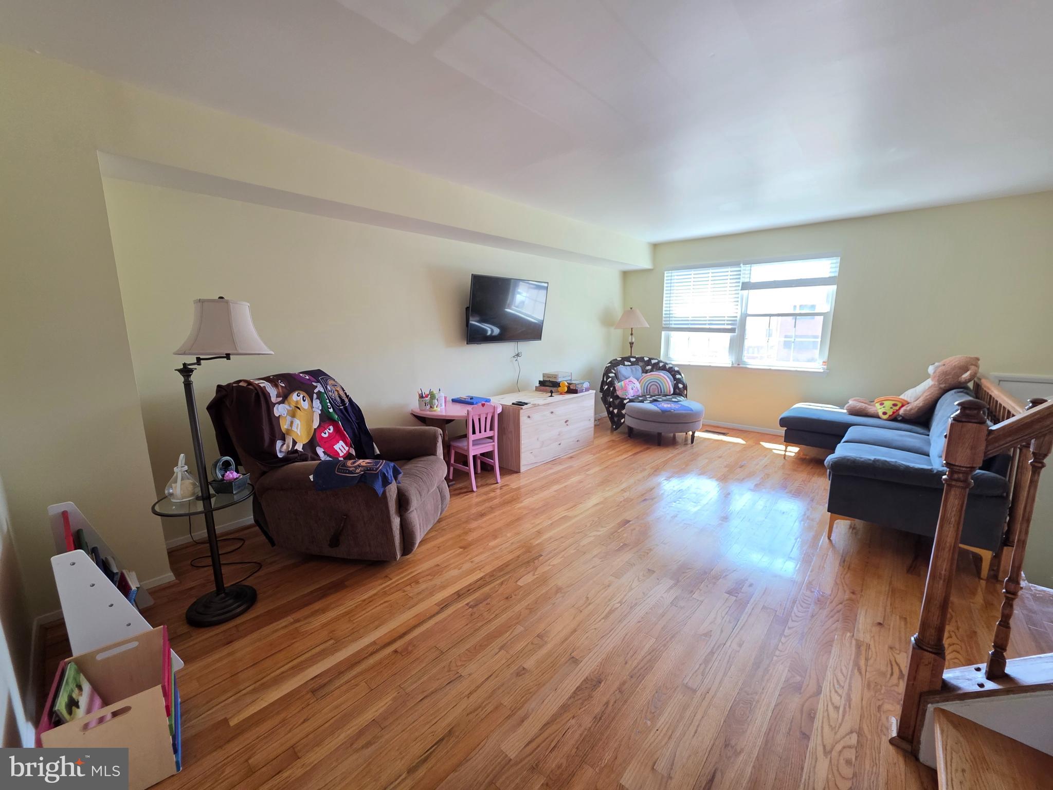 10 Casey Court Baltimore, MD 21228 - Photo 15 of 28 a living room with furniture and a wooden floor
