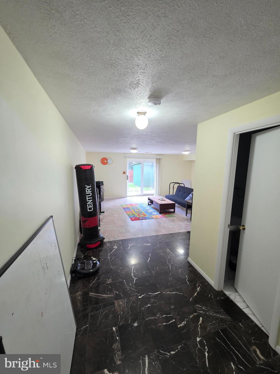 10 Casey Court Baltimore, MD 21228 - Photo 2 of 28 a bed room with a bed furniture and a flat screen tv