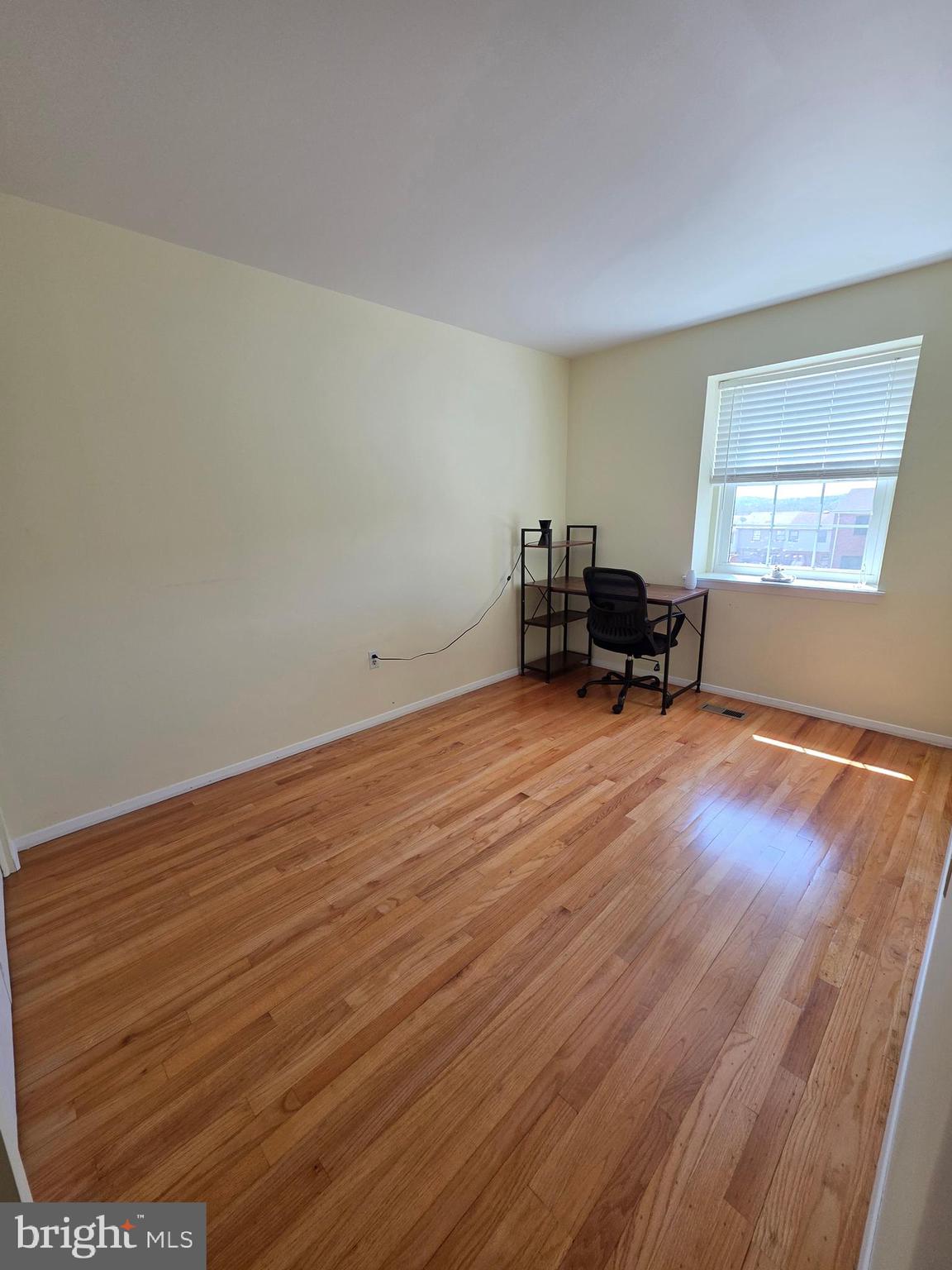 10 Casey Court Baltimore, MD 21228 - Photo 28 of 28 wooden floor in a room with a window