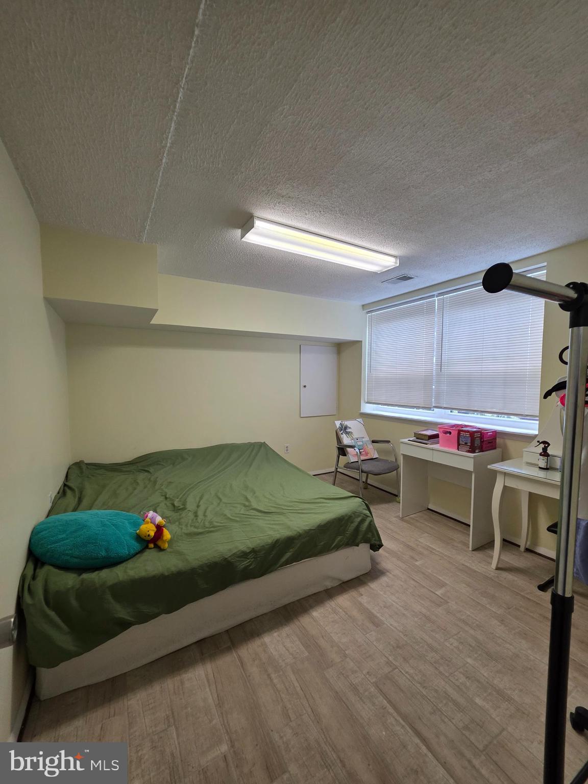 10 Casey Court Baltimore, MD 21228 - Photo 3 of 28 a bedroom with a bed and a desk