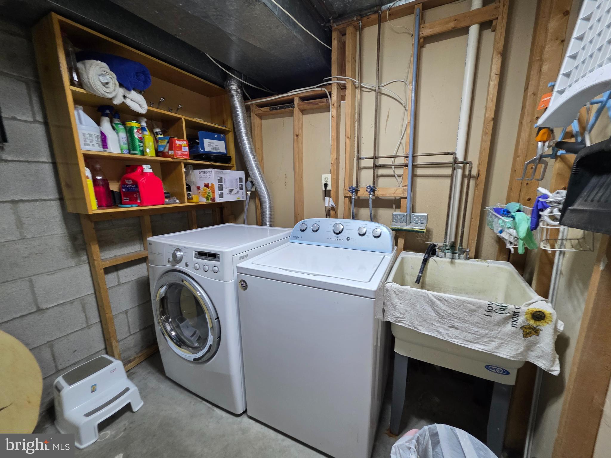 10 Casey Court Baltimore, MD 21228 - Photo 7 of 28 a utility room with dryer washer and a view of living room