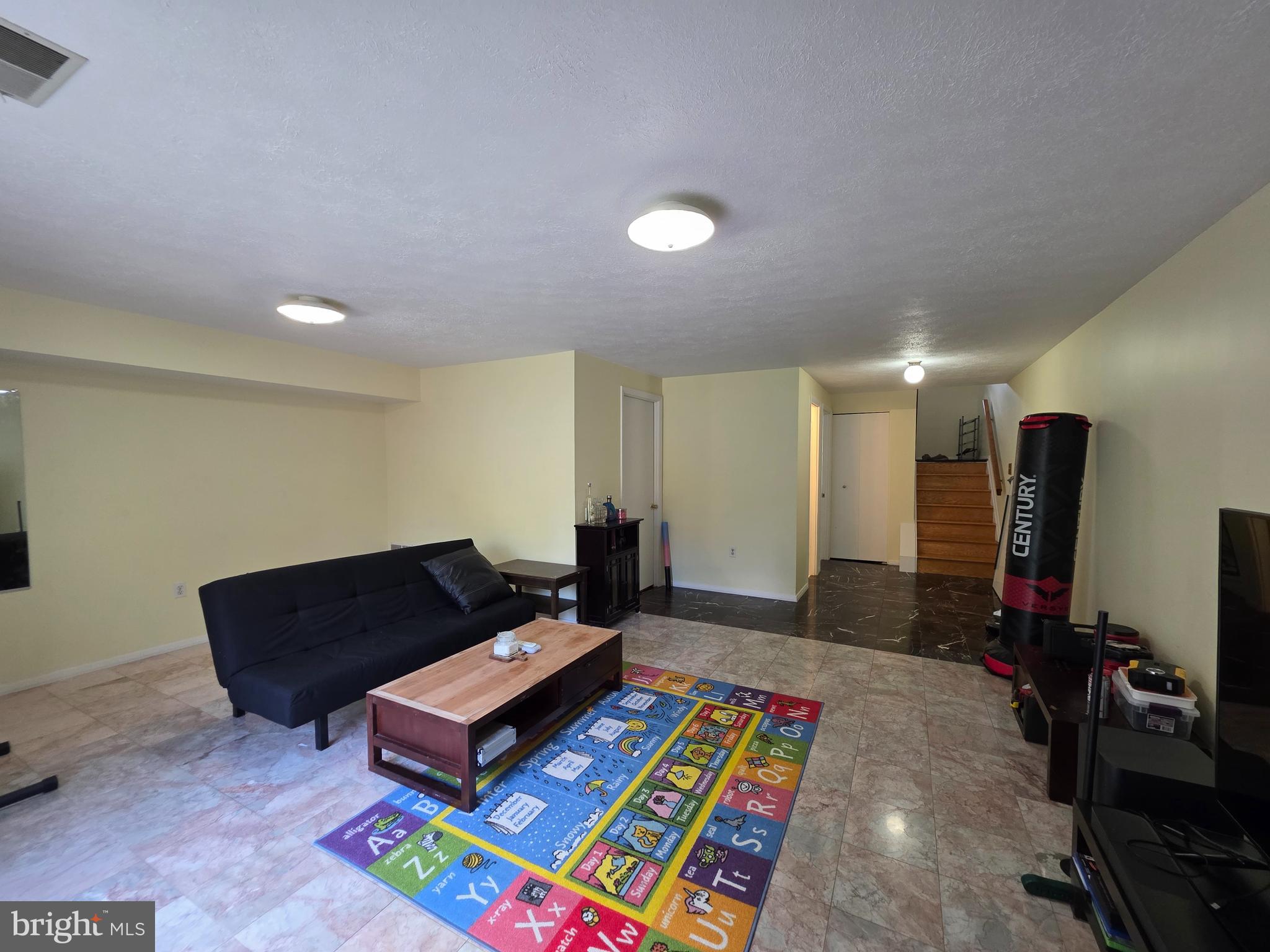 10 Casey Court Baltimore, MD 21228 - Photo 10 of 28 a living room with furniture and a flat screen tv