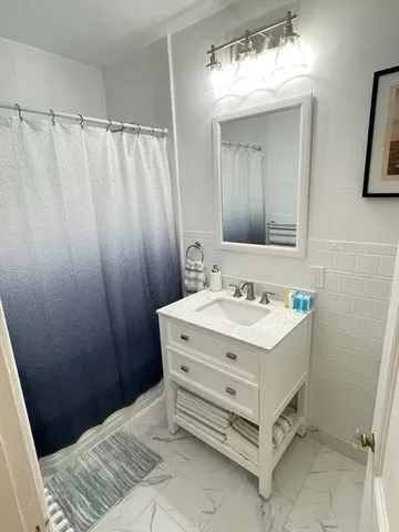 a bathroom with a sink a vanity and a mirror