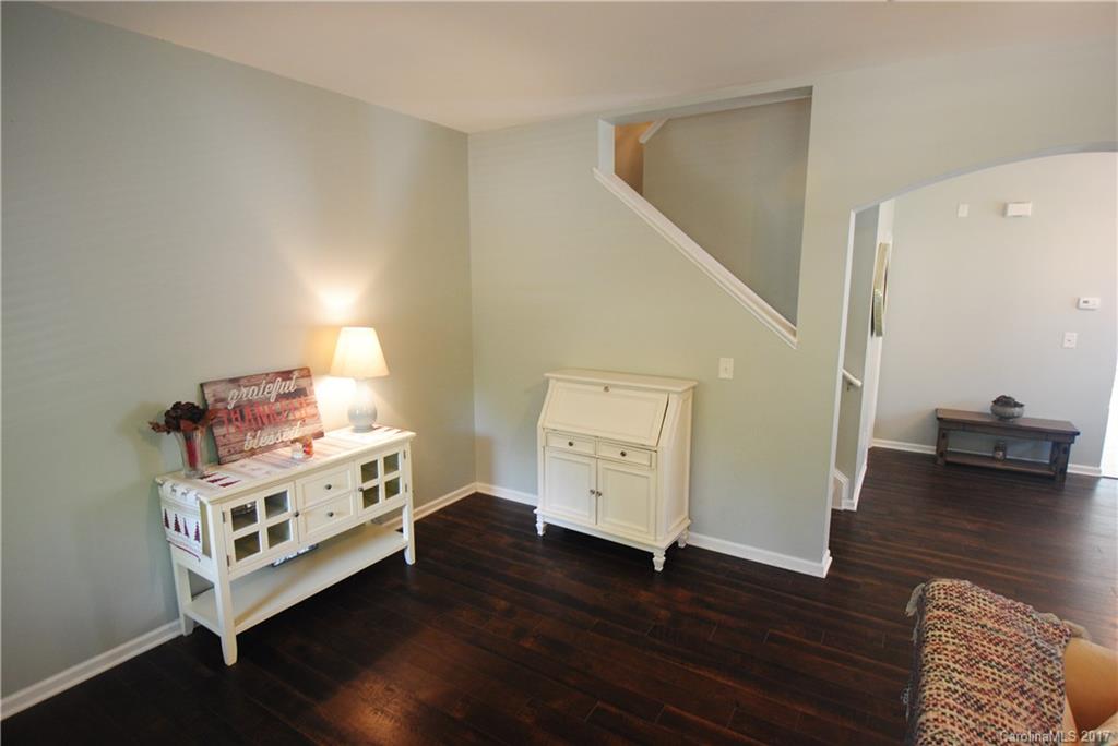 9834 Bailey Road Cornelius, NC 28031 - Photo 6 of 23 a room with furniture and wooden floor