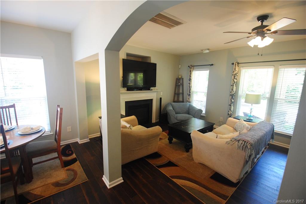 9834 Bailey Road Cornelius, NC 28031 - Photo 7 of 23 a living room with furniture and a fireplace