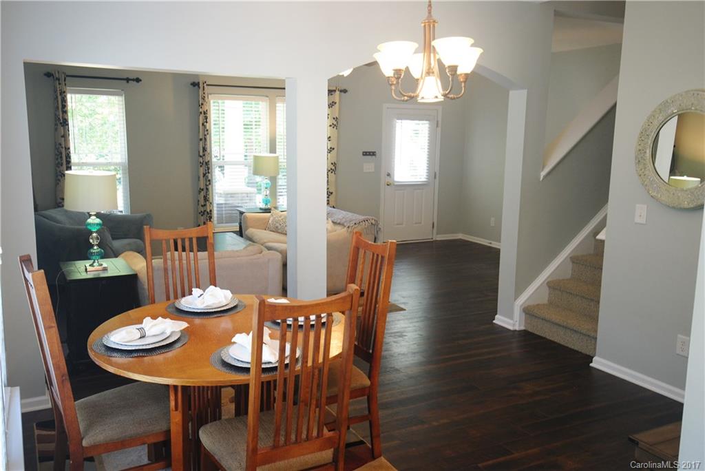 9834 Bailey Road Cornelius, NC 28031 - Photo 8 of 23 a view of a dining room with furniture and wooden floor
