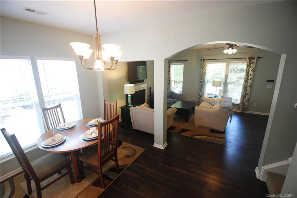 9834 Bailey Road Cornelius, NC 28031 - Photo 9 of 23 a view of a dining room with furniture wooden floor and chandelier