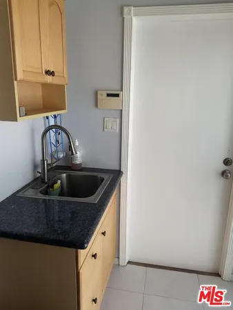 a kitchen with a sink and a window