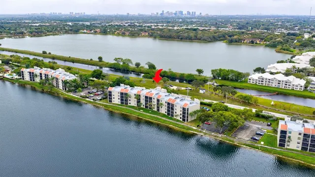 an aerial view of a house with garden space and street view