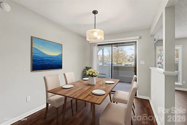 a view of a dining room with furniture window and outside view