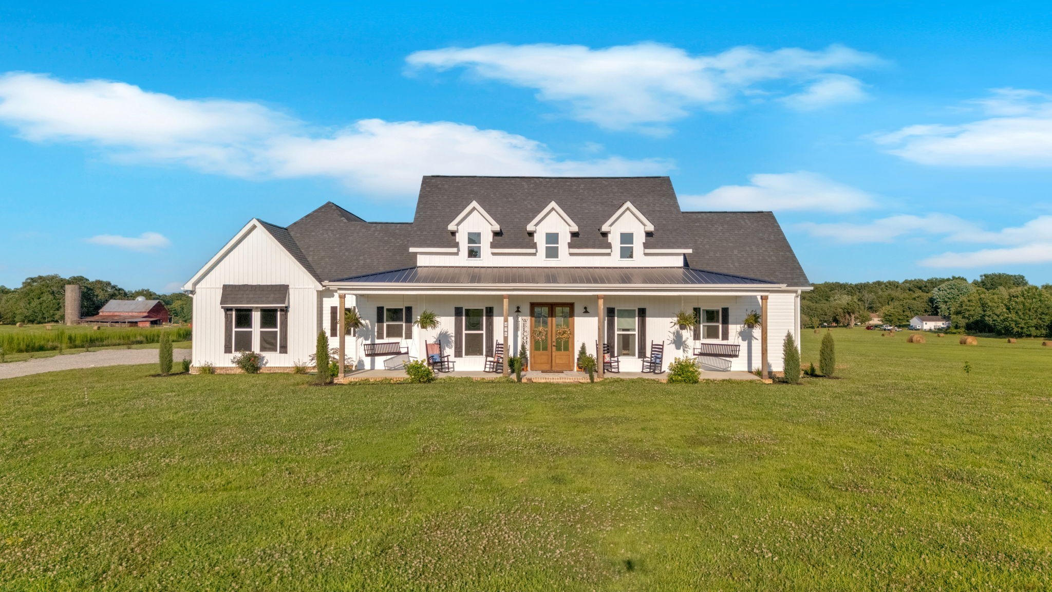 a front view of a house with a garden