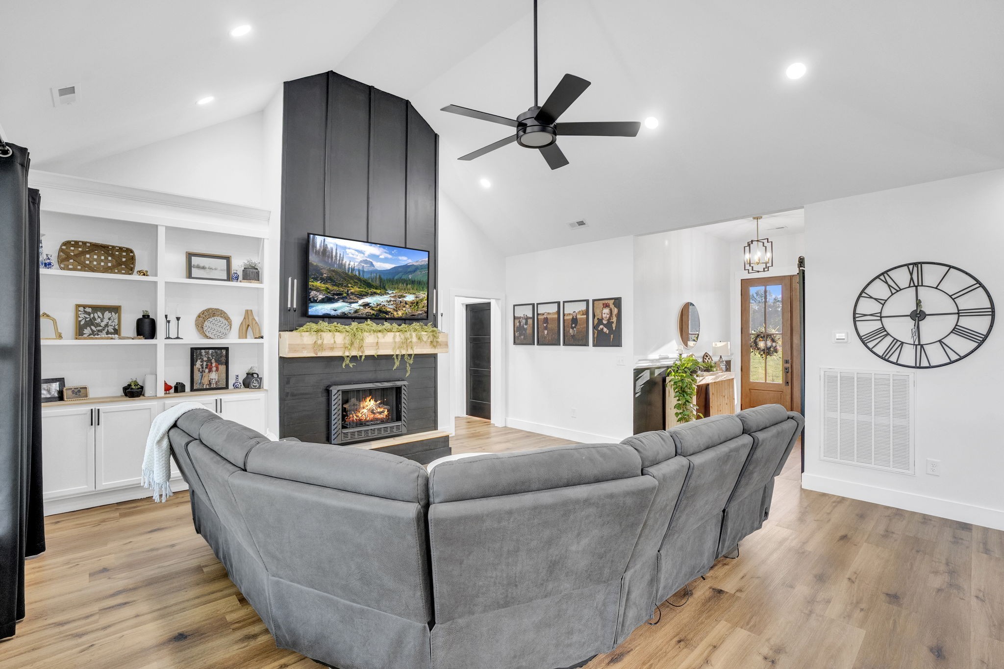 426 Maple Bend Road Winchester, TN 37398 - Photo 11 of 73 a living room with furniture a fireplace and a flat screen tv