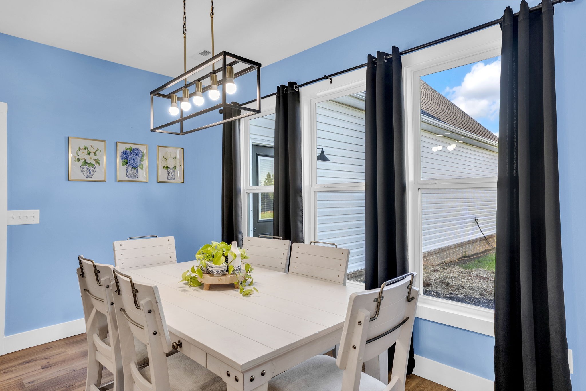 426 Maple Bend Road Winchester, TN 37398 - Photo 21 of 73 a view of a dining room with furniture a chandelier and wooden floor
