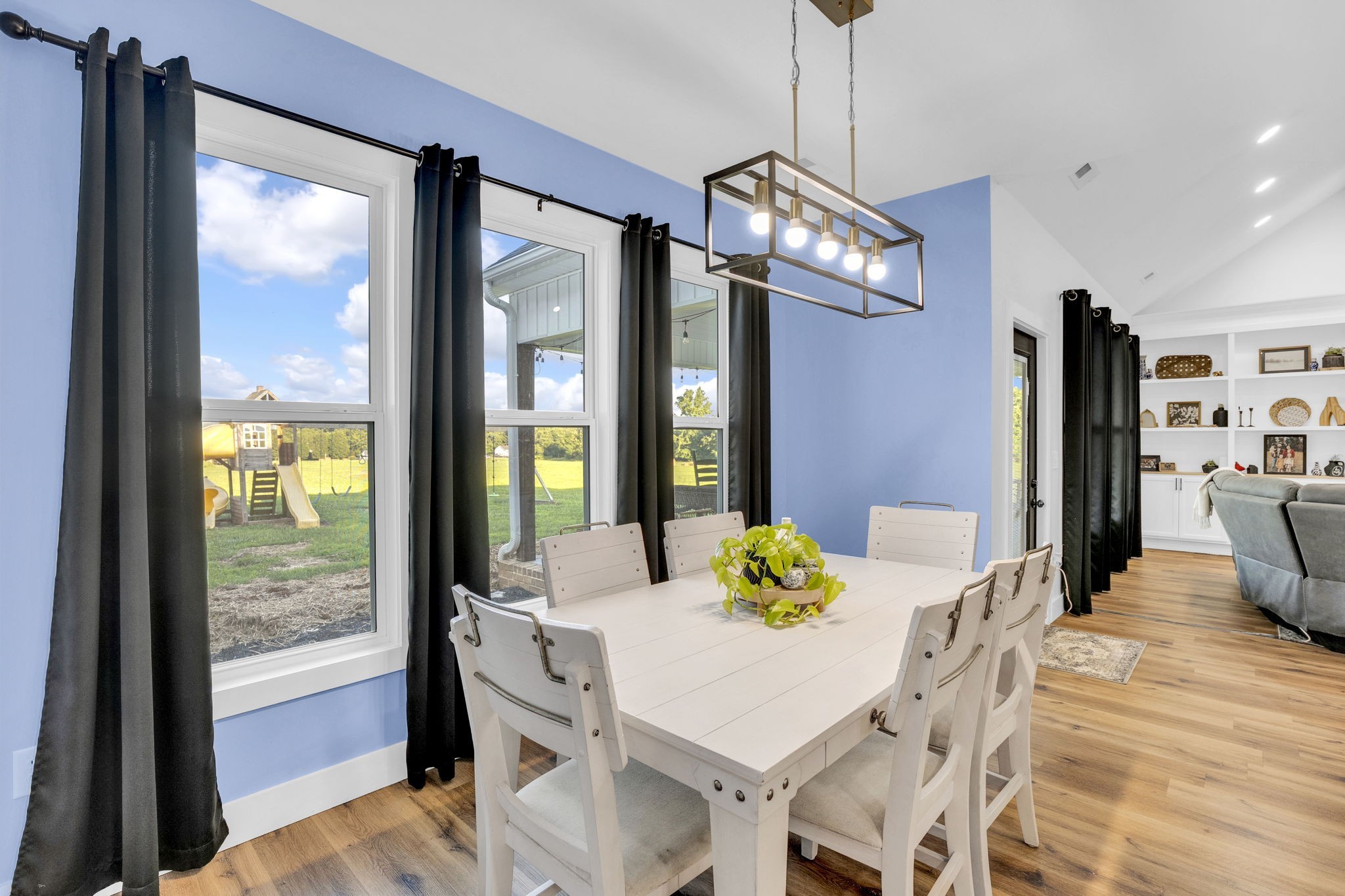 426 Maple Bend Road Winchester, TN 37398 - Photo 22 of 73 a view of a dining room with furniture a chandelier and wooden floor