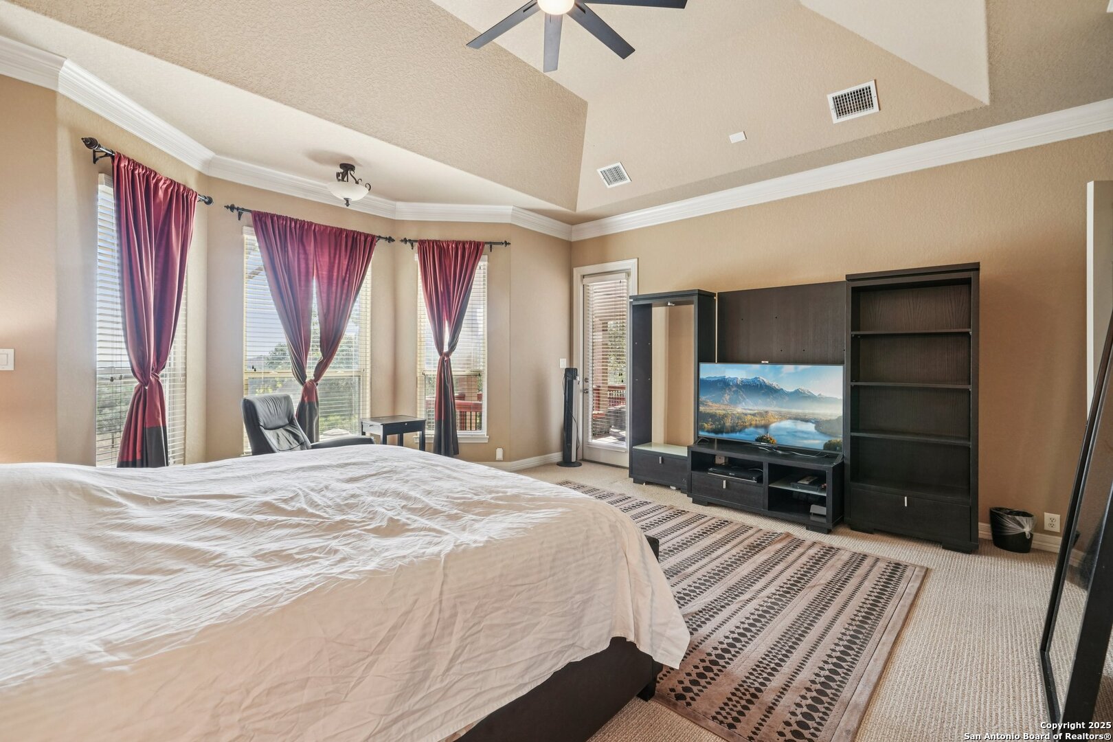 718 Ruidosa Downs Helotes, TX 78023 - Photo 46 of 50 a bedroom with a bed and a flat screen tv