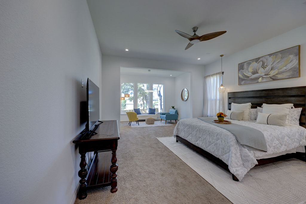 351 Pigeon River Road Kyle, TX 78640 - Photo 17 of 40 Primary Carpeted bedroom featuring ceiling fan and recessed lighting