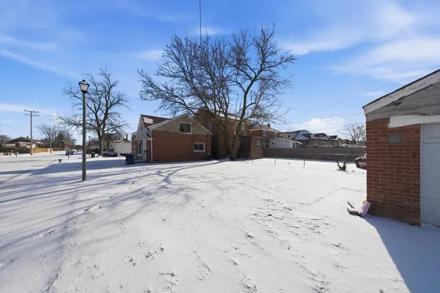 a view of empty space with snow on the road