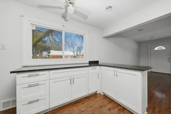 a view of a kitchen with a sink cabinets and a window