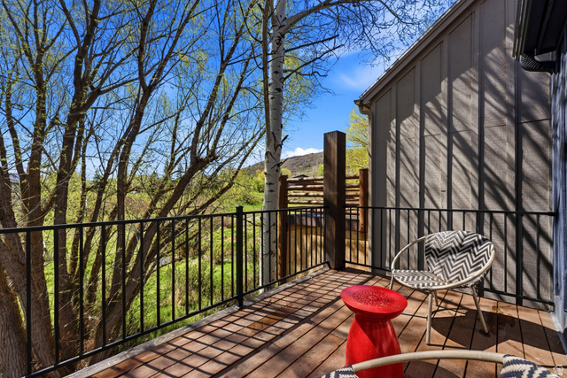 7935 Mustang Loop Road Park City, UT 84098 - Photo 52 of 60 Exterior deck featuring wood-finish flooring and black metal railings