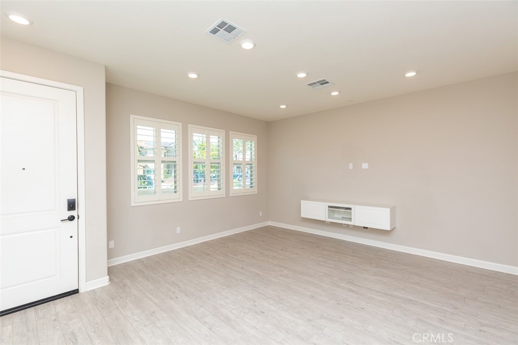 1095 Delpy View Vista Vista, CA 92084 - Photo 7 of 30 an empty room with windows and closet