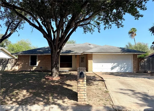 a view of a backyard with a patio