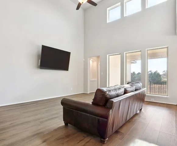 a living room with kitchen island furniture and a large window