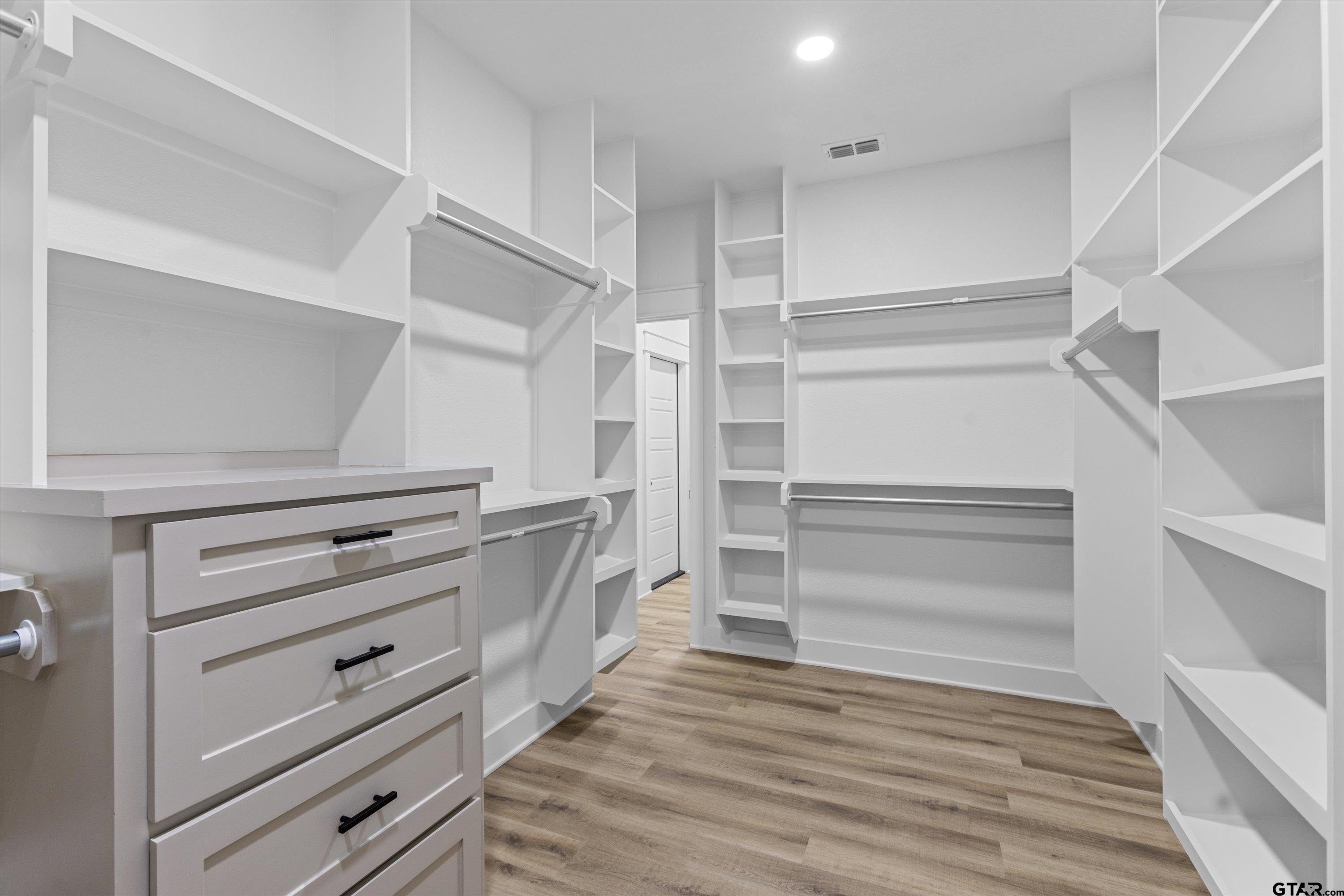 17763 Jayleen Lane Tyler, TX 75707 - Photo 12 of 23 a view of walk in closet with empty racks