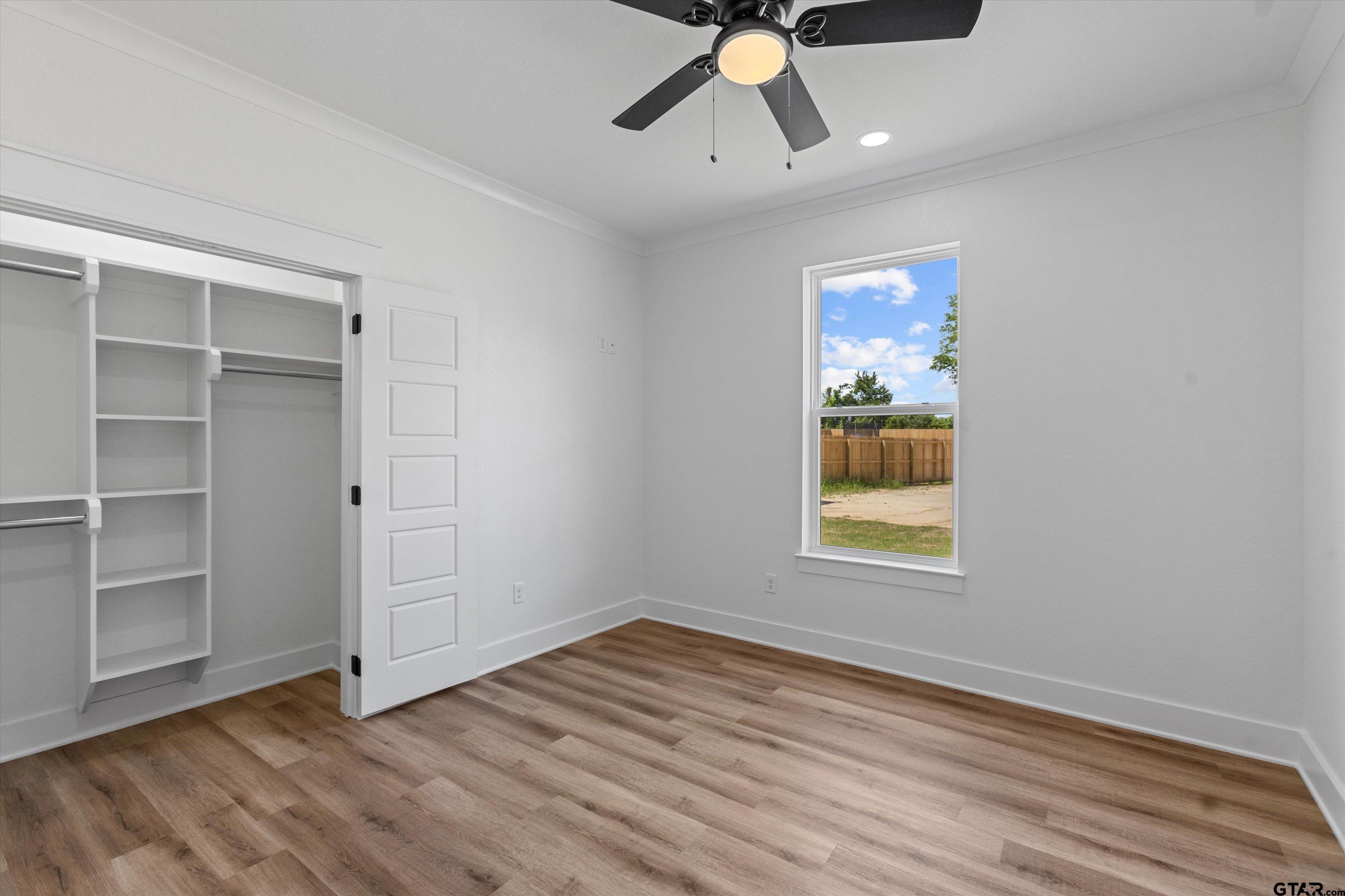 17763 Jayleen Lane Tyler, TX 75707 - Photo 17 of 23 wooden floor in an empty room with a window