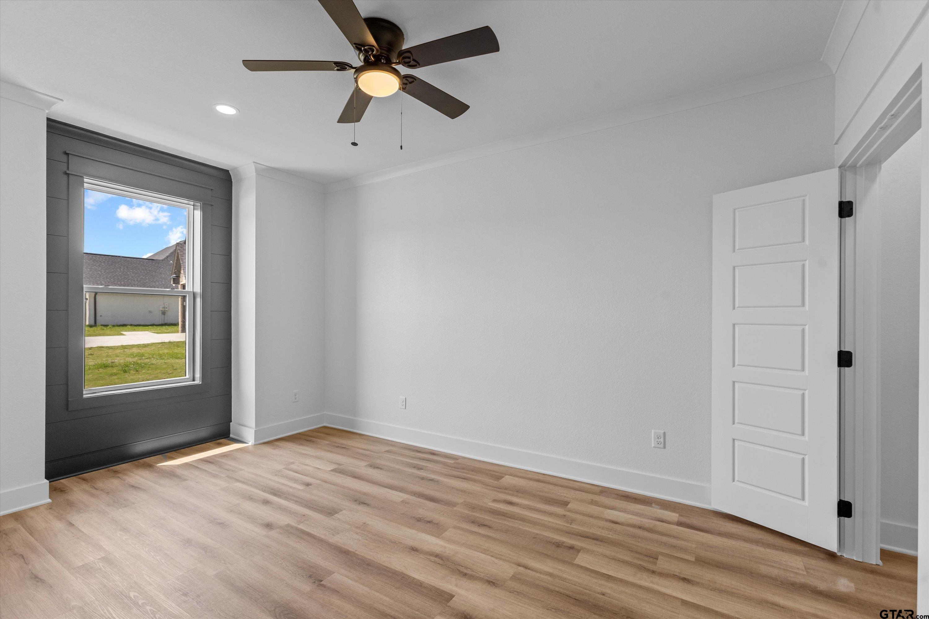 17763 Jayleen Lane Tyler, TX 75707 - Photo 19 of 23 wooden floor in an empty room with a window