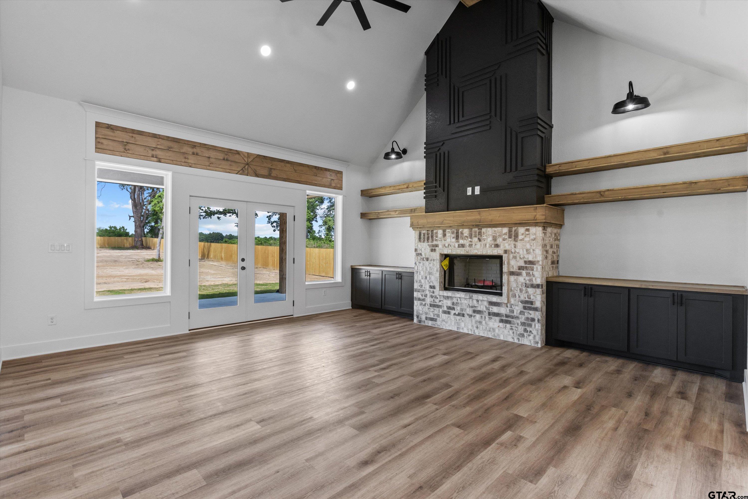 17763 Jayleen Lane Tyler, TX 75707 - Photo 3 of 23 a view of a livingroom with a fireplace a fireplace and windows