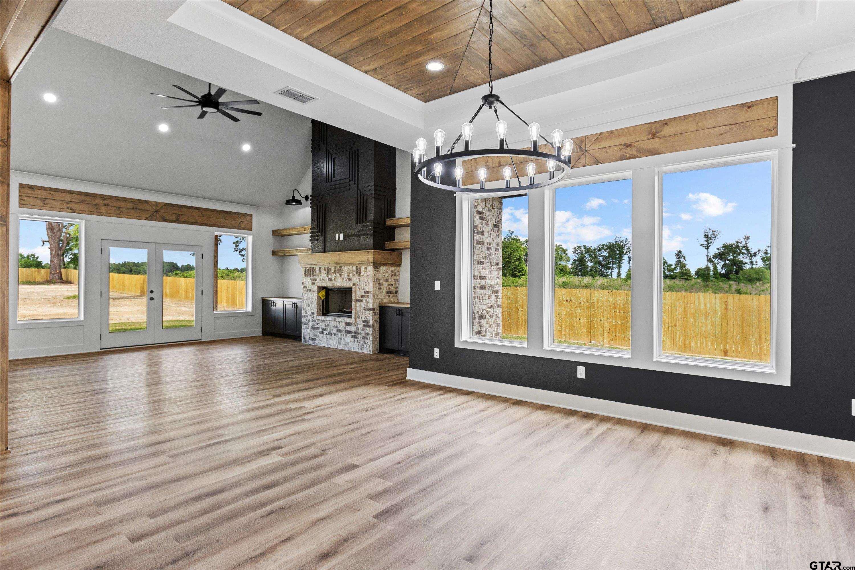 17763 Jayleen Lane Tyler, TX 75707 - Photo 4 of 23 a view of an empty room with a window and kitchen view