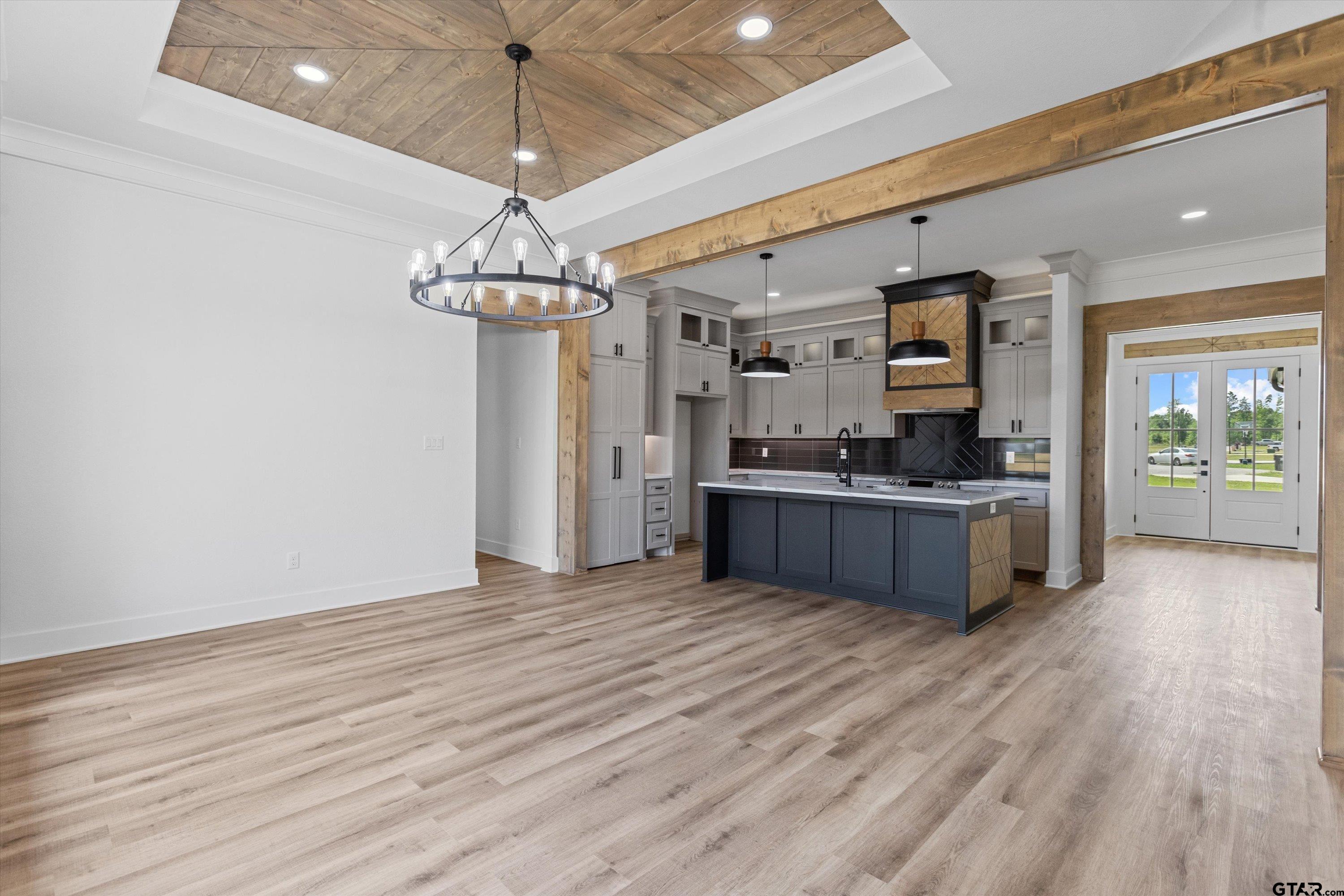 17763 Jayleen Lane Tyler, TX 75707 - Photo 5 of 23 a kitchen with stainless steel appliances granite countertop a sink cabinets and wooden floor