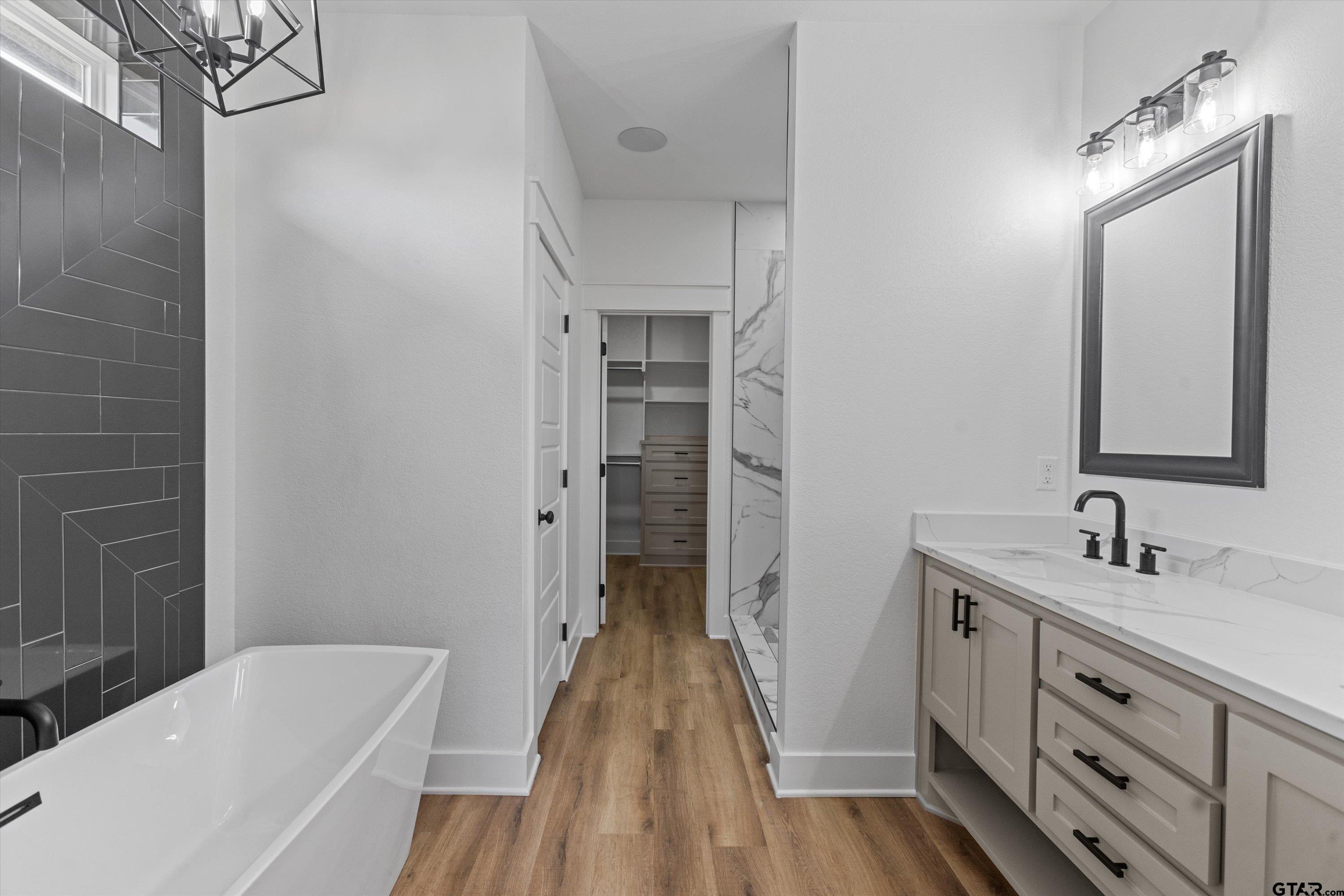 17763 Jayleen Lane Tyler, TX 75707 - Photo 10 of 23 a bathroom with a sink and a bathtub