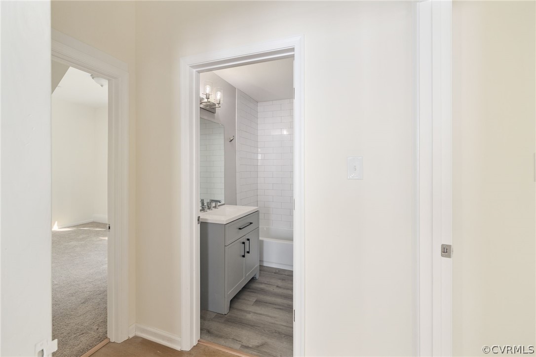 5205 Blue Ridge Avenue Richmond, VA 23231 - Photo 14 of 30 a bathroom with a sink and a mirror