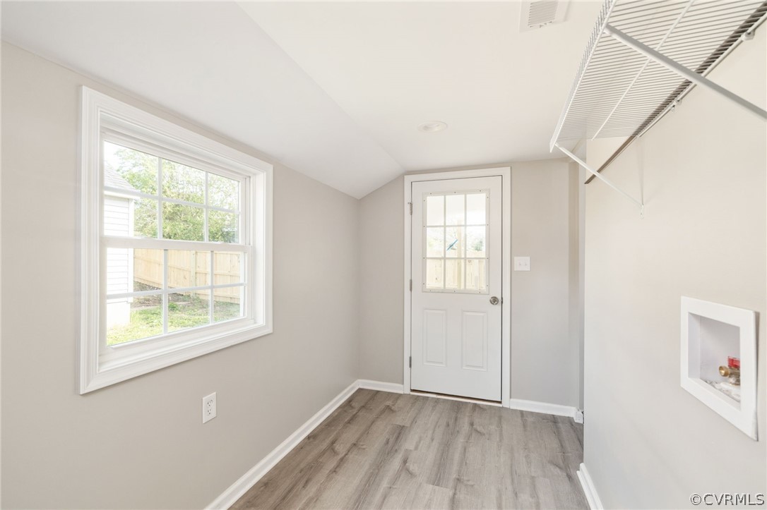 5205 Blue Ridge Avenue Richmond, VA 23231 - Photo 19 of 30 an empty room with wooden floor and windows