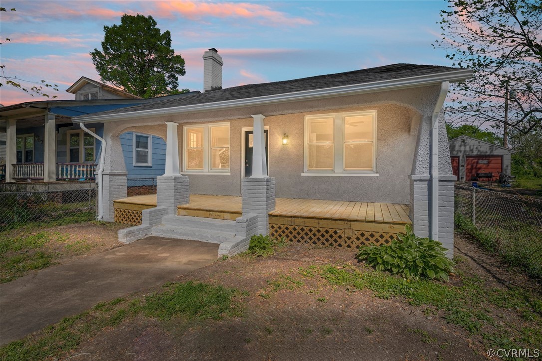 5205 Blue Ridge Avenue Richmond, VA 23231 - Photo 2 of 30 a front view of a house with a yard and porch