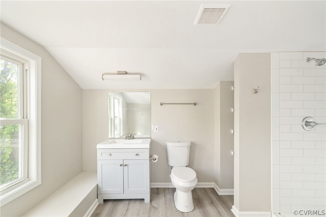 5205 Blue Ridge Avenue Richmond, VA 23231 - Photo 23 of 30 a bathroom with a sink toilet a mirror and shower