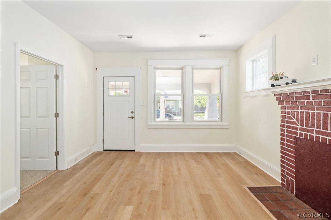 5205 Blue Ridge Avenue Richmond, VA 23231 - Photo 7 of 30 an empty room with wooden floor and windows