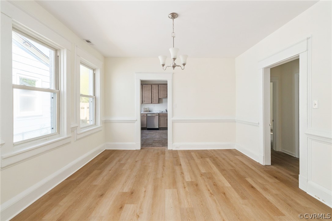 5205 Blue Ridge Avenue Richmond, VA 23231 - Photo 9 of 30 a view of empty room with wooden floor and windows