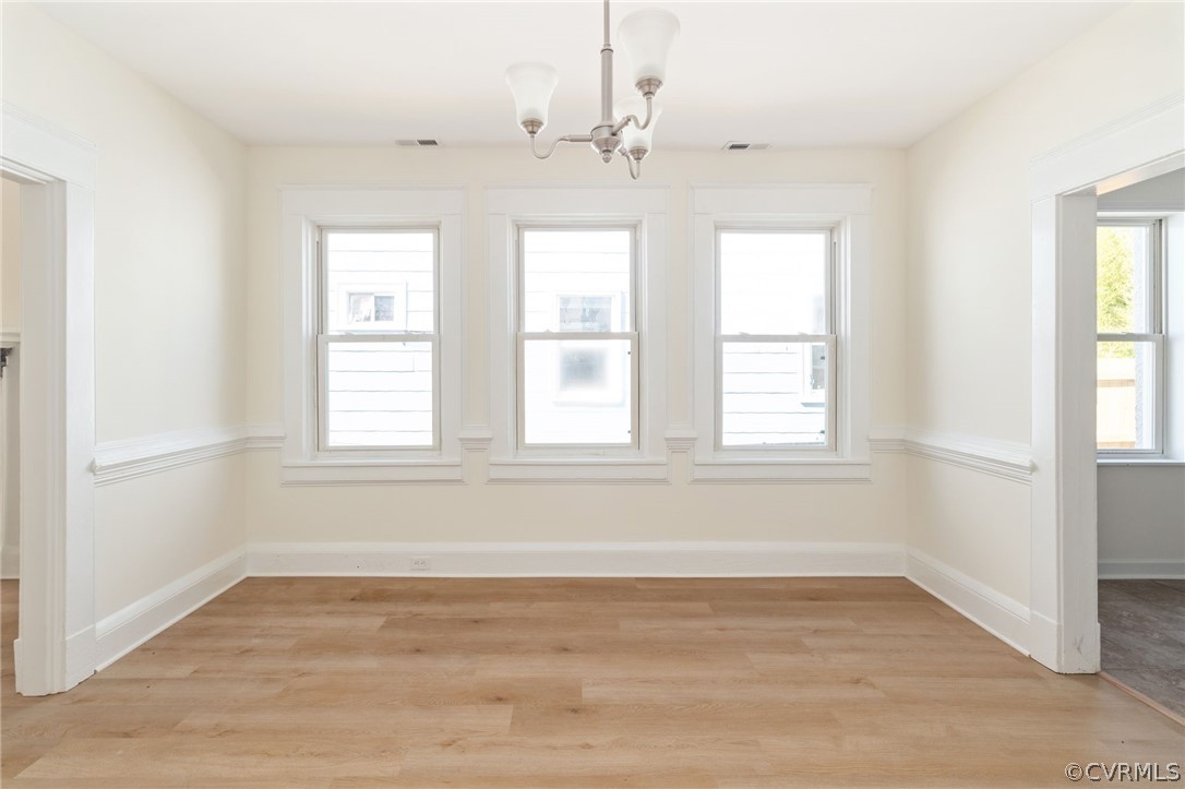 5205 Blue Ridge Avenue Richmond, VA 23231 - Photo 10 of 30 wooden floor in an empty room with a window