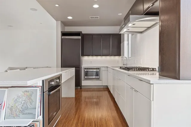 a kitchen with granite countertop a stove and a sink
