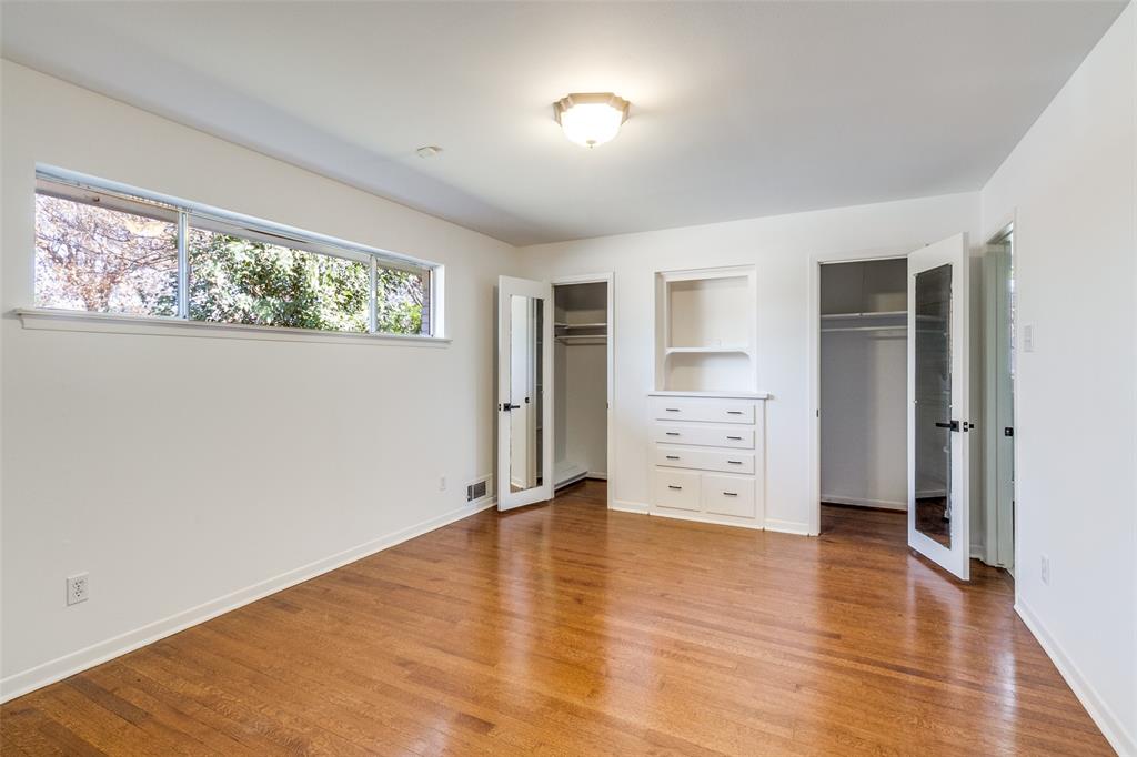 8060 Woodhue Road Dallas, TX 75228 - Photo 22 of 29 Bedroom 3/Primary. Two connected closets