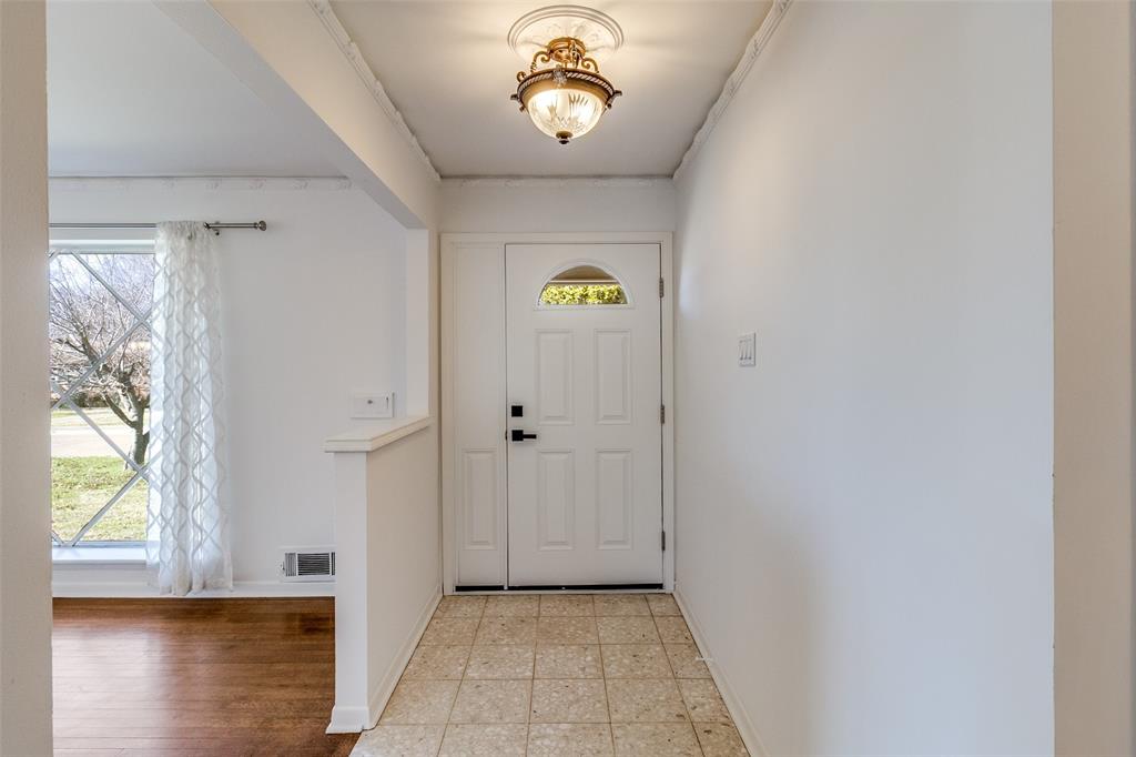 8060 Woodhue Road Dallas, TX 75228 - Photo 4 of 29 Original terrazzo tiles in the entrance. Hardwoods throughout.