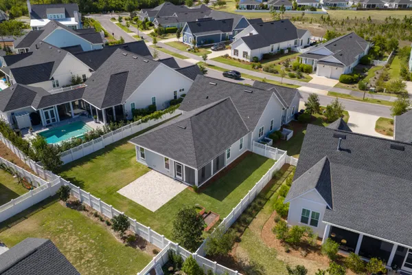 an aerial view of a house with a ocean view