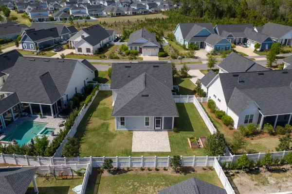 an aerial view of houses with yard