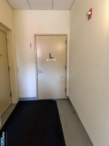 a view of a hallway with front door