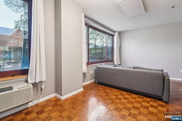 a room with a bed and a window