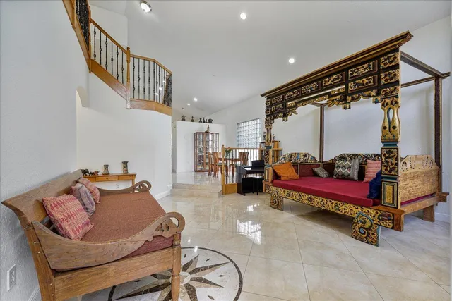 a bedroom with furniture and a book shelf