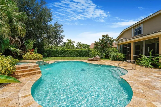 a view of swimming pool with a yard