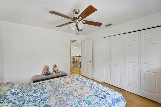 a bedroom with a bed and cabinets